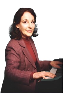 An enhanced  color photograph of Judy Bailey wearing a red blazer at a piano with arms extended.