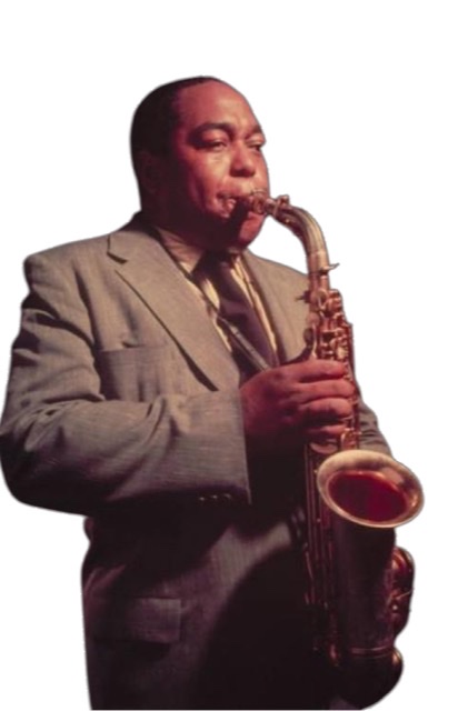 A colorized photograph of Charlie Parker standing upright playing his saxophone.