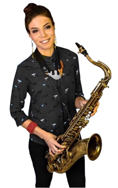 A color photograph of Melissa Aldana holding her tenor saxophone with a light blue background in 2021.