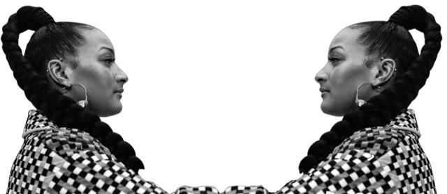A black and white photographic cutout of identical Nubya Garcia's facing each other in mirror image with hoop earrings in profile with a thick single braid coming off the top of her head and hanging down onto her shoulder.