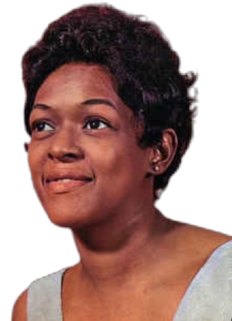 Organist Shirley Scott gazing forward as a young woman while seated.