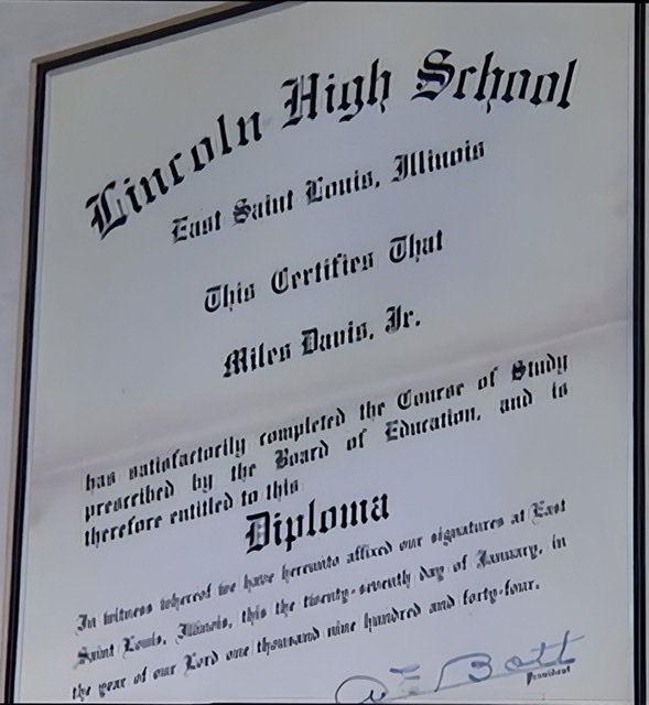 A photograph of a framed high school diploma for Miles Davis Jr. from 1944.