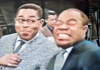 Dizzy Gillespie and Louis Armstrong laughing on Timex All-Star Jazz Show in 1959.