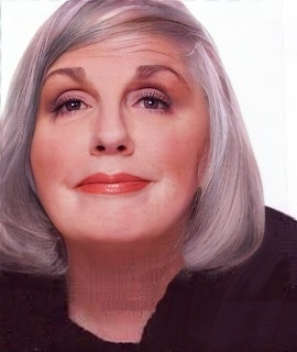A color photograph of a middle-aged Carol Sloane with shiny gray hair curled under at sides of her head.