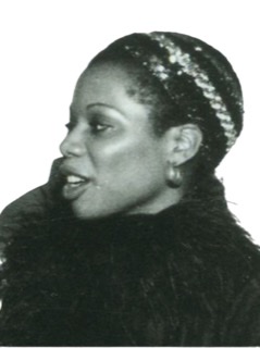 Sharon Freeman closeup headshot profile facing to right.