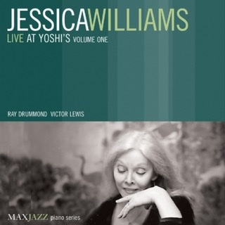 The dark green album cover for "Live at Yoshi's, Volume One" by the Jessica Williams trio with the title on top half and a photograph of Williams sitting with her open left hand propped under her chin on the bottom half.