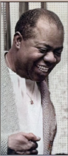 A colorized photograph if Louis Armstrong wearing a tweed style sport coat facing twisted to right and wearing a star of David ✡️ necklace with a big smile and no trumpet.