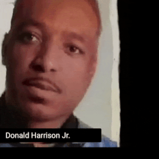 An animated photograph of the head of Donald Harrison, Jr. moving around and looking to his right at Stanley Clarke.