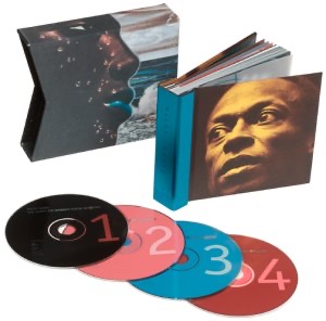 A photograph of the box set and four CDs from "The Complete Bitches Brew Sessions" by Miles Davis.