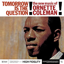 The album cover for "Tomorrow is the Question" by Ornette Coleman with the title written in black font across the top fourth of the album cover and the rest has a color photograph of Ornette Coleman's head facing left.