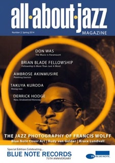 A color photograph of the second issue of All About Jazz magazine, No. 2, Spring 2014 celebrating the jazz photography of Francis Wolff with a burnt mustard circle surrounding a photograph of a black jazz musicians wearing dark sunglasses on a black background.