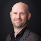 A color photograph of the head of philosopher Christopher Bartel.