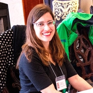 Dr. Bresnahan smiling while chairing the American Society for Aesthetics Spring 2016