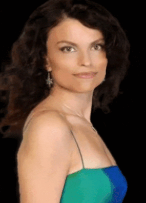 A color .gif photograph of Roberta Gambarini in a blue and green straps dress facing to the right.