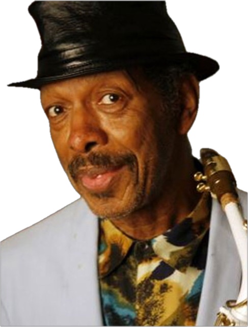 Ornette Coleman with a quizzical expression on his face and wearing a black hat while holding his alto saxophone.