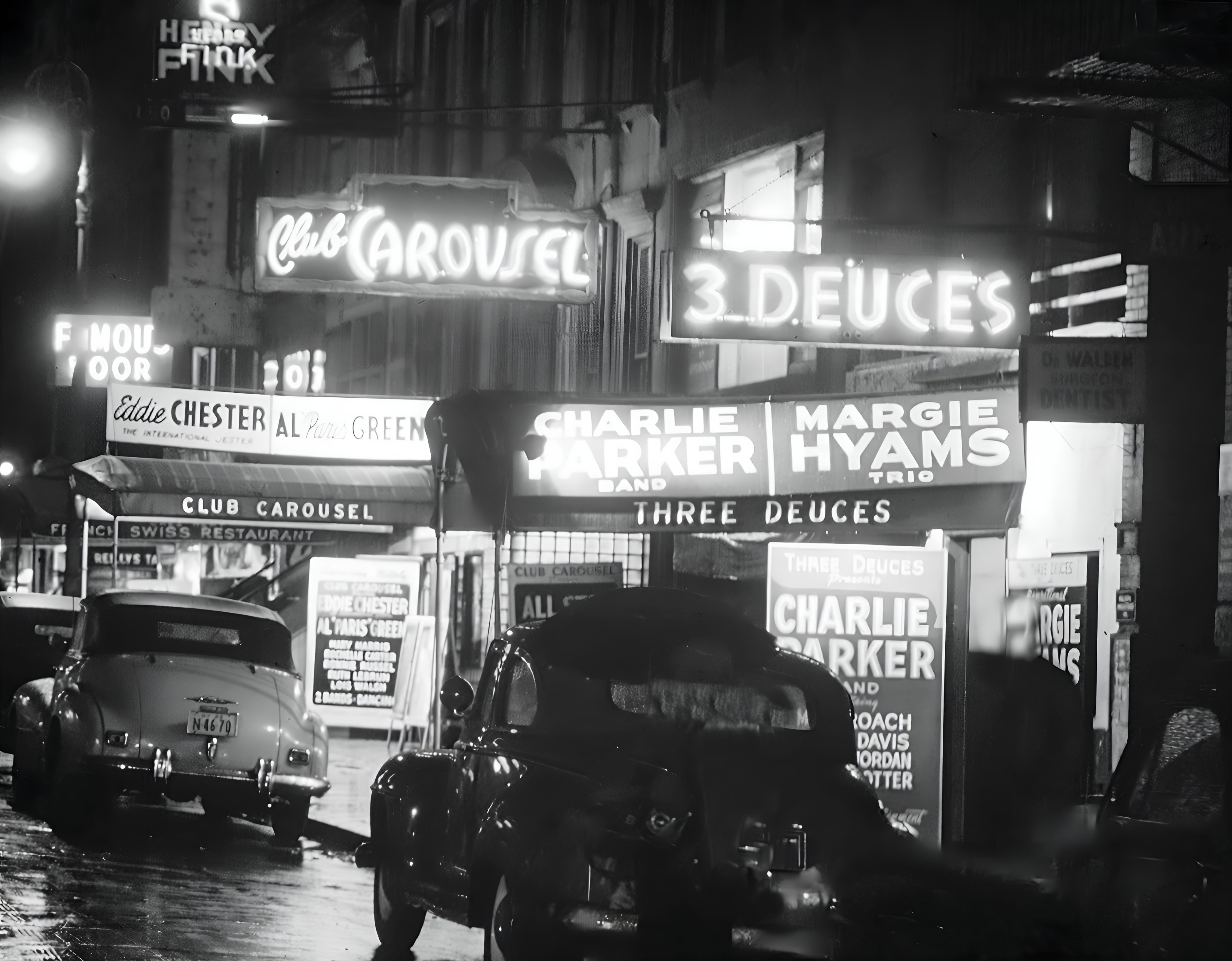 An enhanced black & white photograph of the neon marquee's containing Charlie Parker and Margie Hyams trio on 52nd street in New York City taken by William P. Gottlieb.