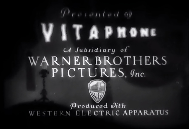 A black and white screen capture of the credits of production title for the film short "The Band Beautiful" by Vitaphone.
