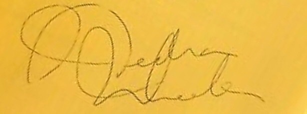 Nedtra Wheeler's autograph on yellow paper.