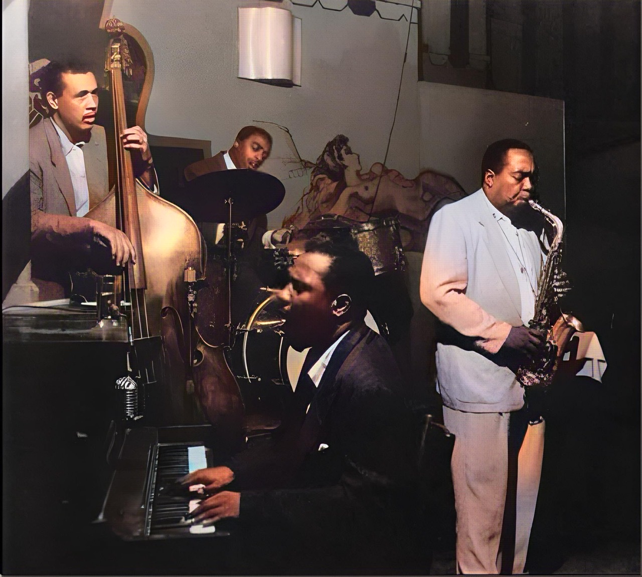 A colorized and enhanced photograph of alto saxophonist Charlie Parker, pianist Thelonious Monk, bassist Charles Mingus, and drummer Roy Haynes jamming at The Open Door in Greenwich Village, September, 1953.