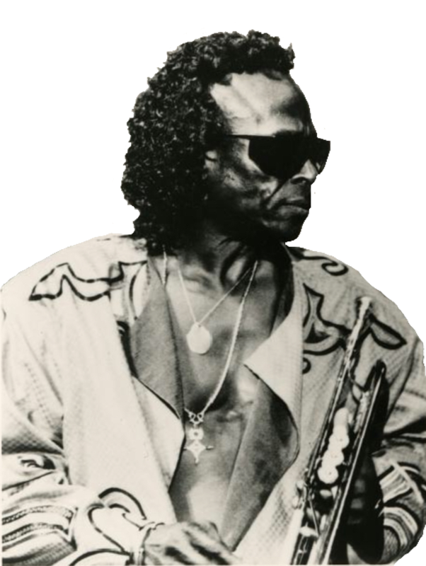 A photographic cutout of late Miles Davis facing to the right with an open shirt and several chains with medallions exposed on his bare chest while holding his trumpet in is left hand at chest height with bell pointing straight down.